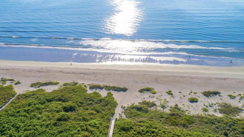 an aerial view of a beach and the ocean at Tropical Paradise at Diplomat in Cocoa Beach