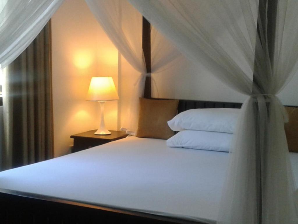 Postel nebo postele na pokoji v ubytování Apna Homestay Apartments