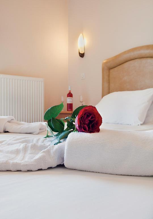 Postel nebo postele na pokoji v ubytování Epidavria Hotel
