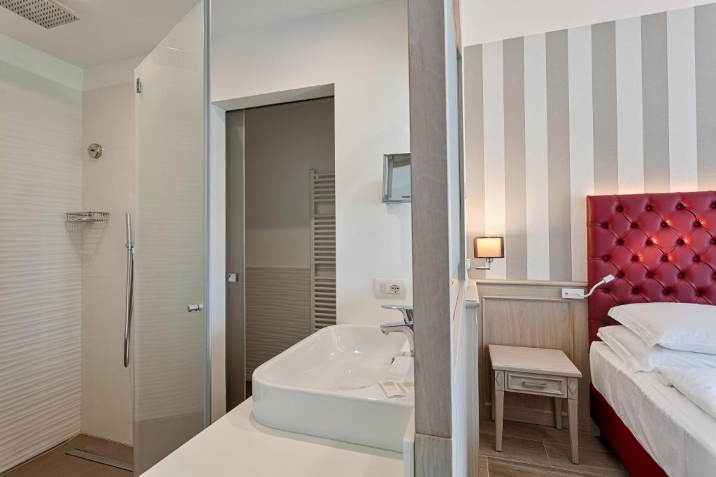 Postel nebo postele na pokoji v ubytování Hotel Bellariva