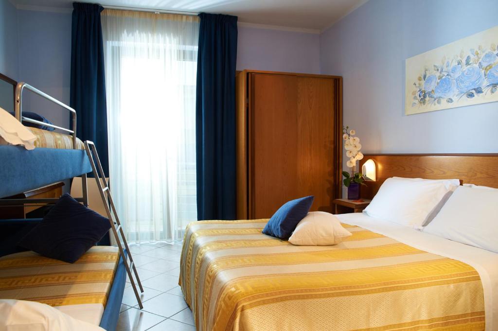 Postel nebo postele na pokoji v ubytování Hotel Sirio