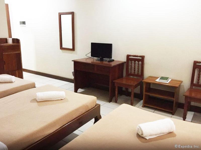TV a/nebo společenská místnost v ubytování El Haciendero Private Hotel