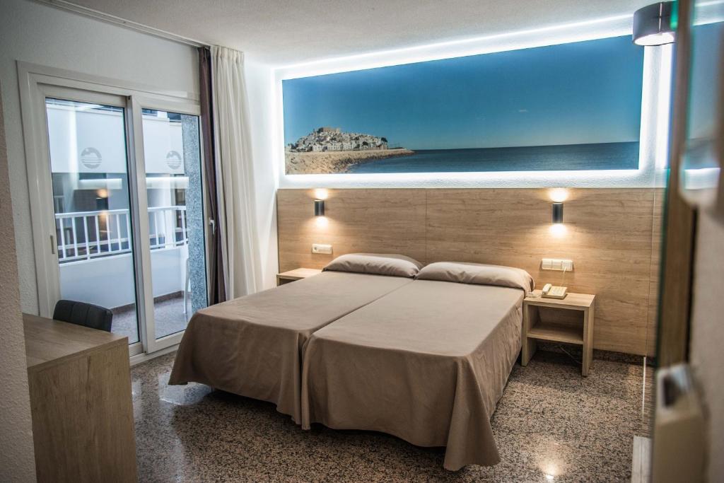 Postel nebo postele na pokoji v ubytování Hotel Arena Prado