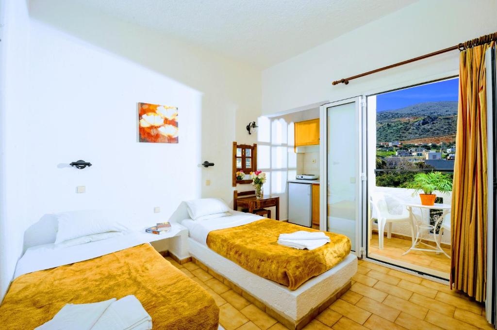 Posteľ alebo postele v izbe v ubytovaní Stelios Residence Apartments