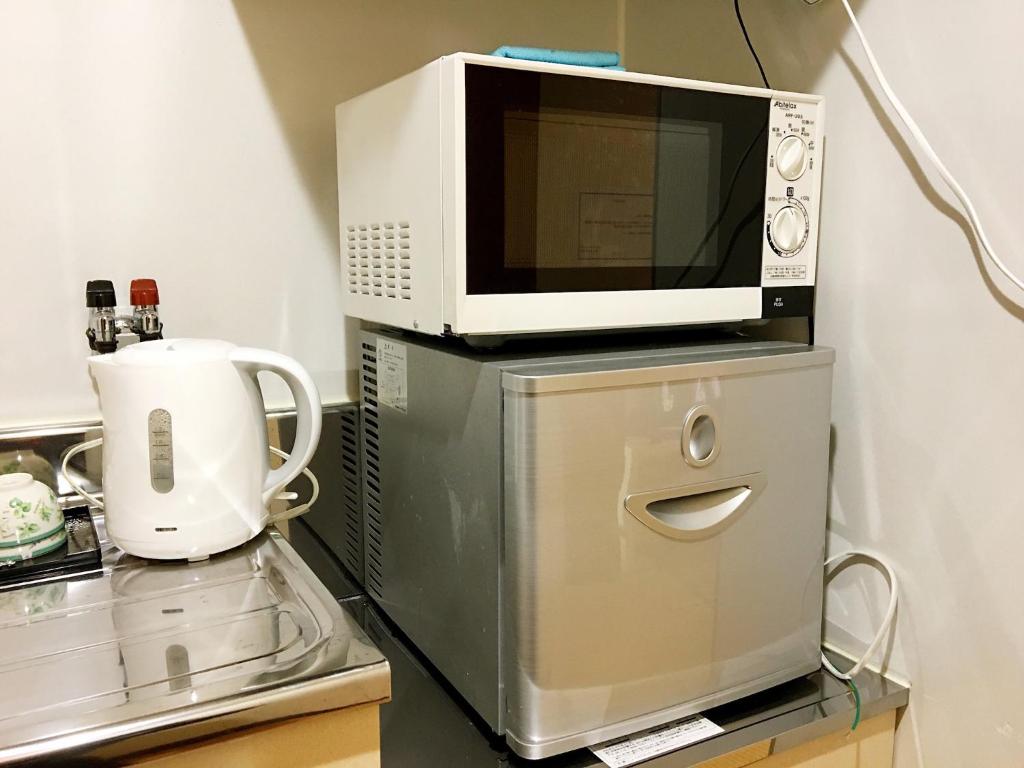 Kuchyň nebo kuchyňský kout v ubytování Osaka Tengachaya Guesthouse SAYURI II