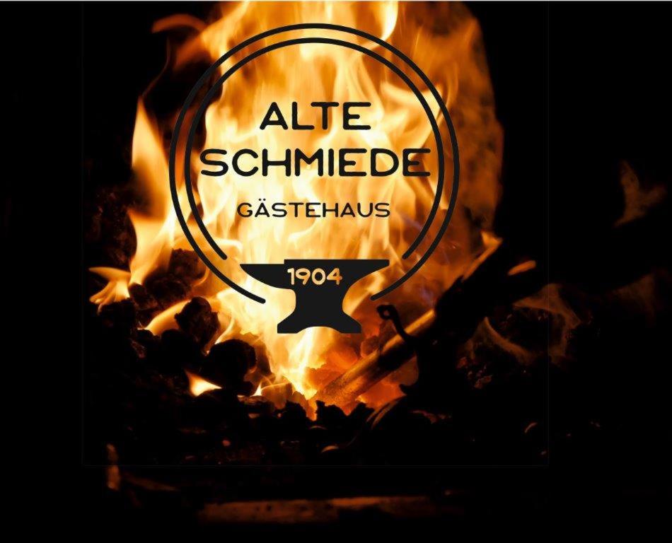 a sign that says ate simulated ashes on fire at Alte Schmiede in Ascheberg