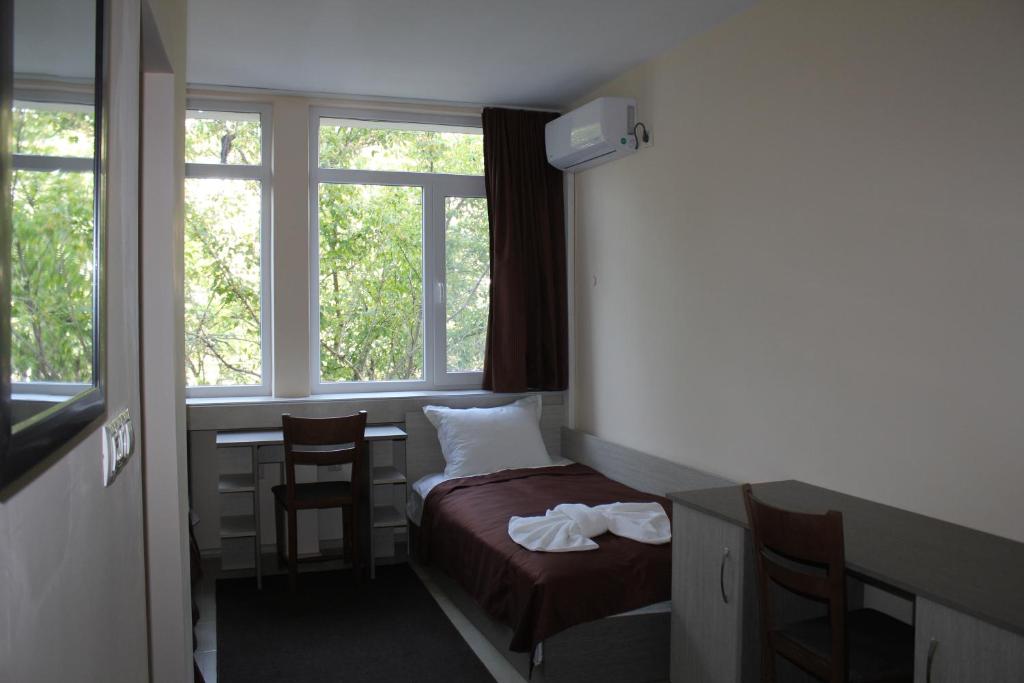 A bed or beds in a room at Hostel Penev