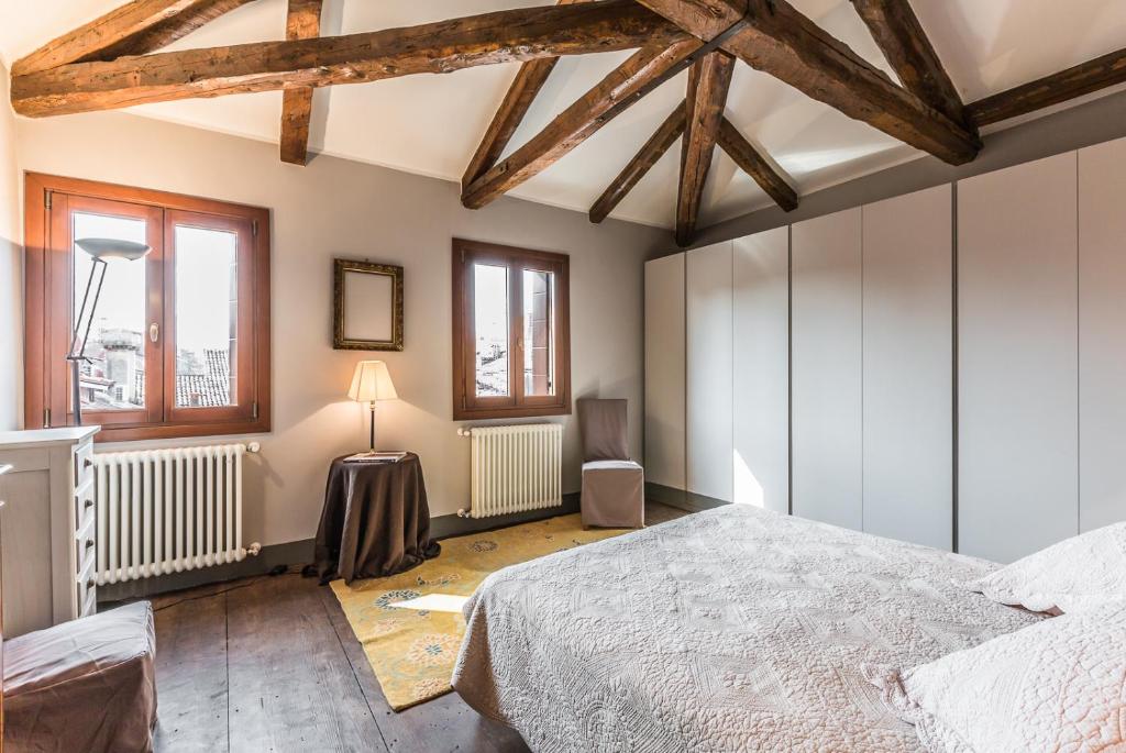 Posteľ alebo postele v izbe v ubytovaní Ca' Del Pittore Terrace