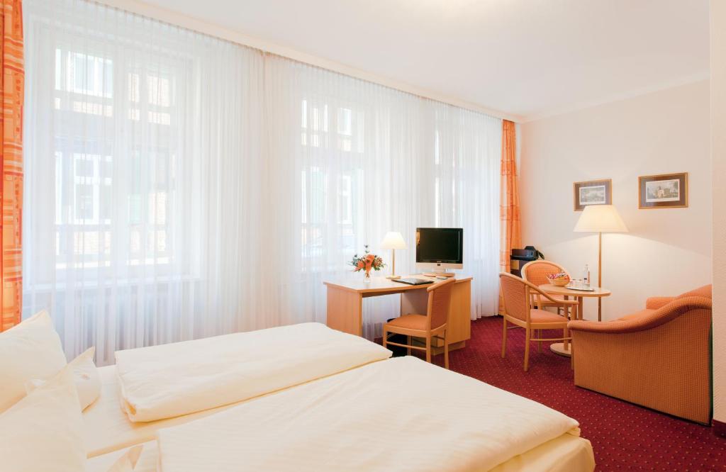 Postel nebo postele na pokoji v ubytování Hotel Benn
