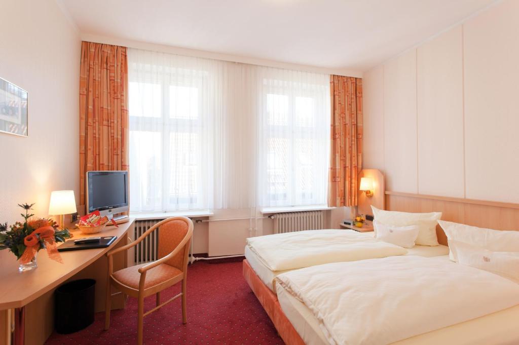 Postel nebo postele na pokoji v ubytování Hotel Benn