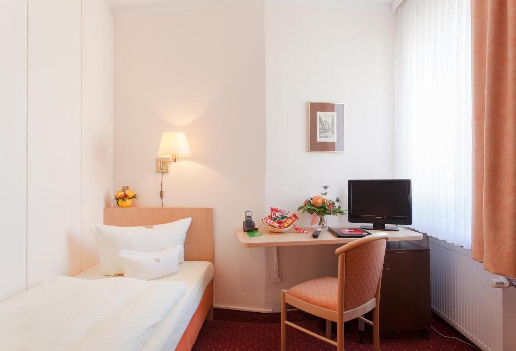 Postel nebo postele na pokoji v ubytování Hotel Benn