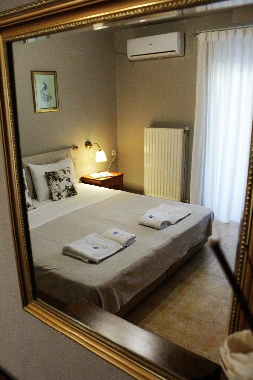 Łóżko lub łóżka w pokoju w obiekcie Mirthios Felicity Apartment