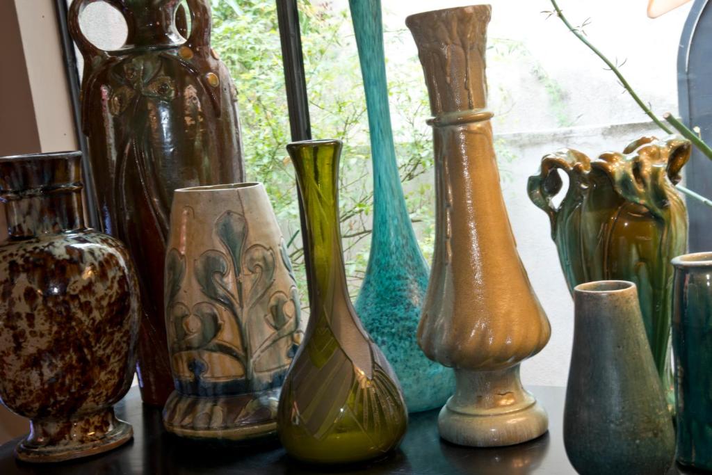 a group of vases sitting on a table at Les Chambres de l'Abbaye in Marseille
