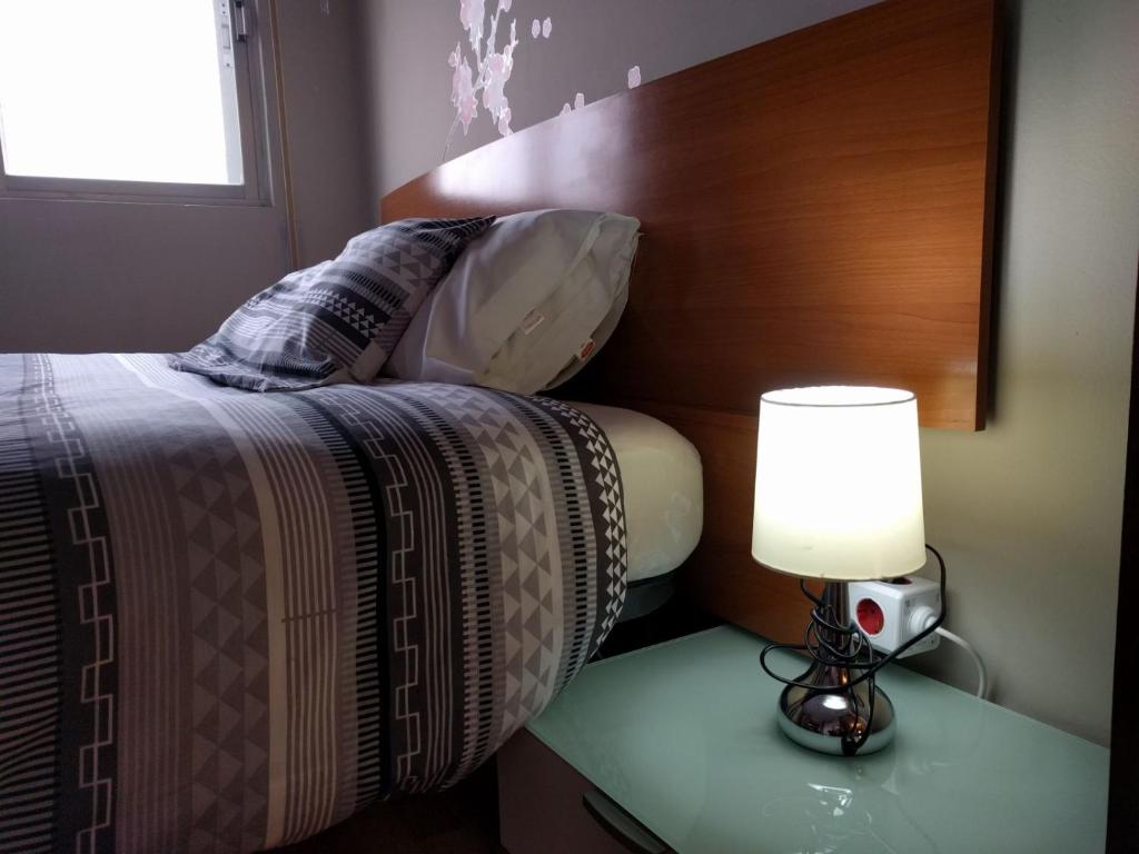Posteľ alebo postele v izbe v ubytovaní www apartamentovaldivia es Parking incluido