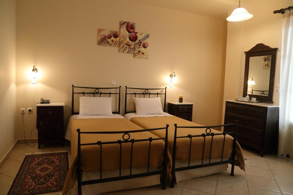 Postel nebo postele na pokoji v ubytování Mani Hotel