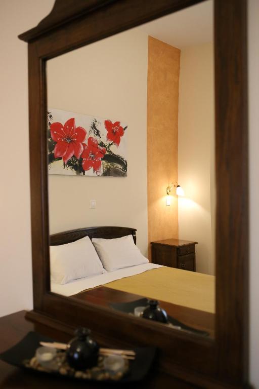 Postel nebo postele na pokoji v ubytování Mani Hotel