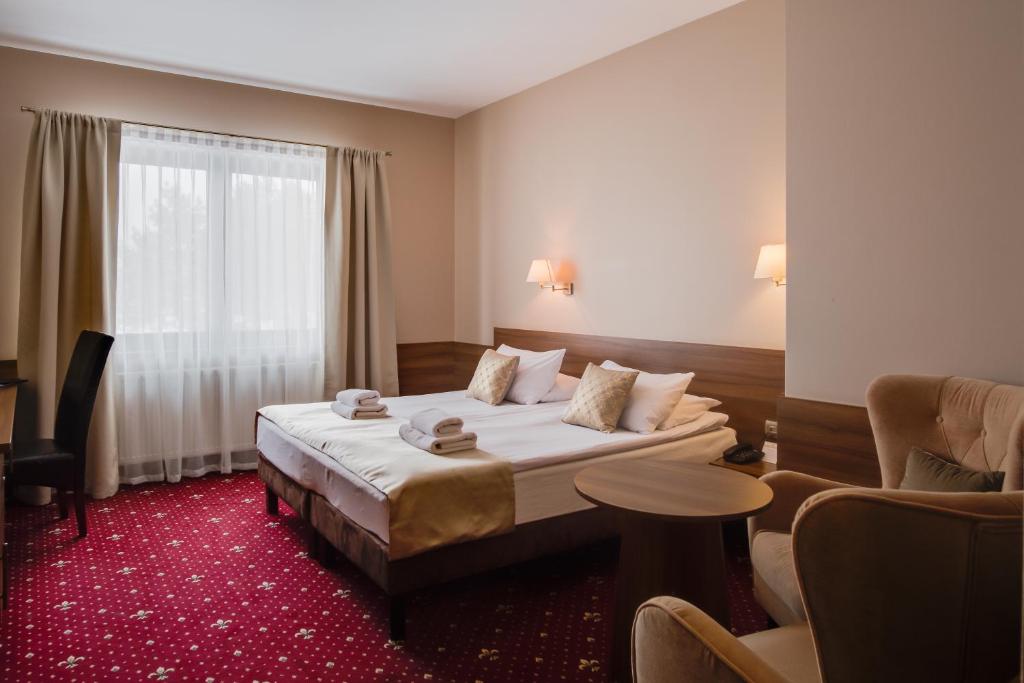 Posteľ alebo postele v izbe v ubytovaní Hotel Cristal Park