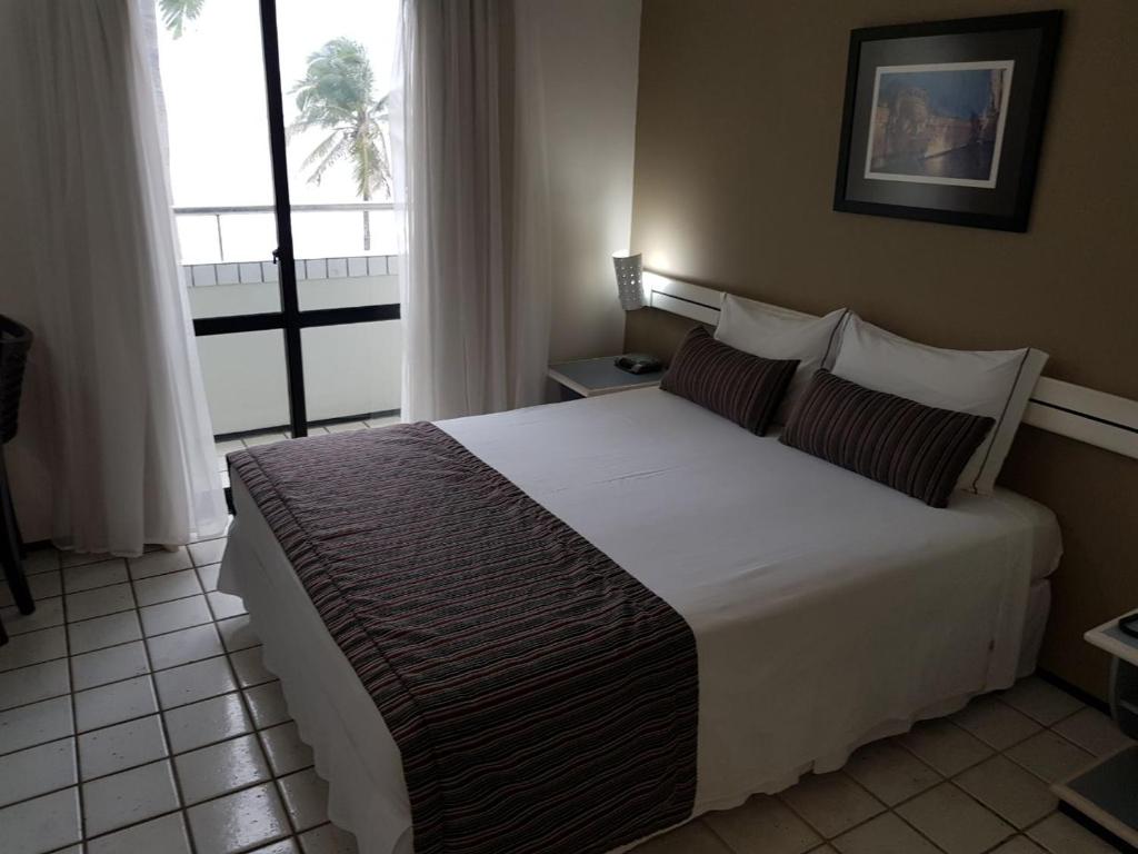 Postel nebo postele na pokoji v ubytování Brisamar Hotel & SPA São Luís