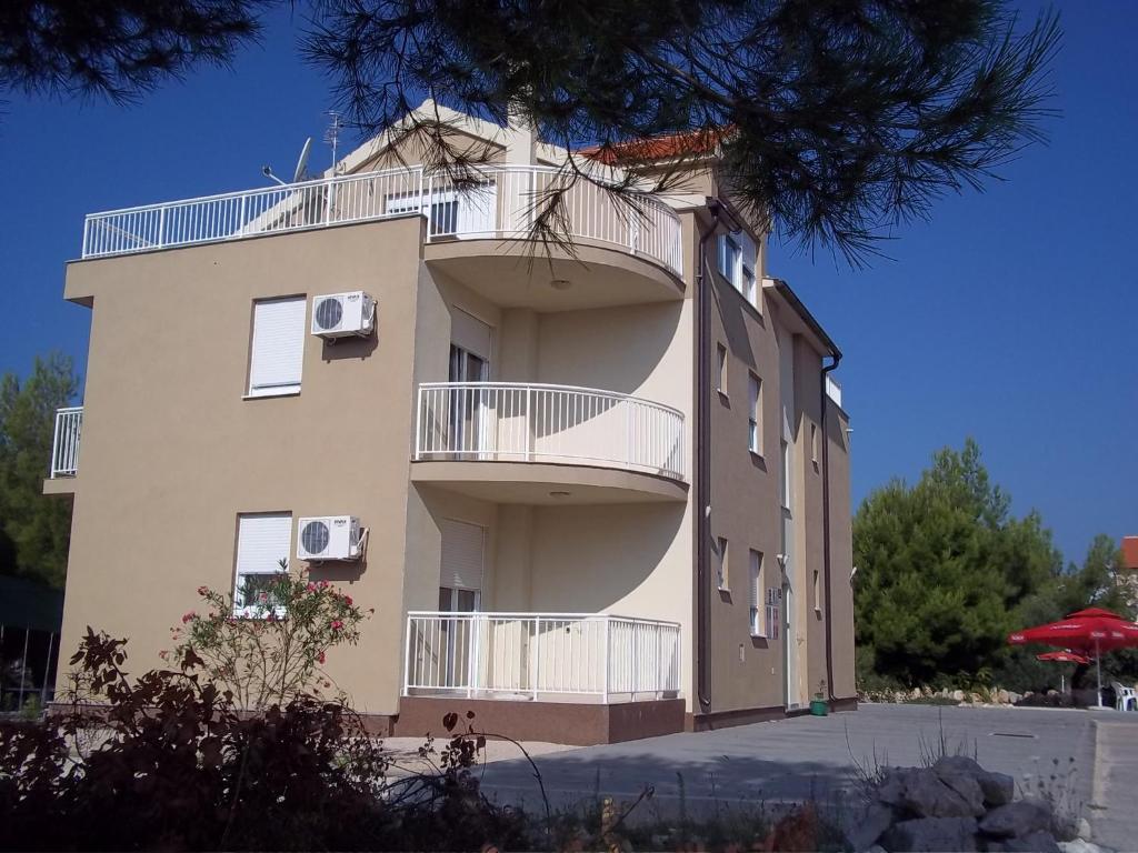 a building with balconies on the side of it at Vila Ivančica 2 in Vodice