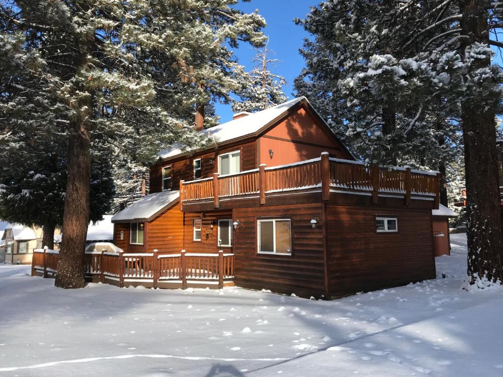 a log cabin in the snow with trees at Angel Bear Cabin in Big Bear Lake