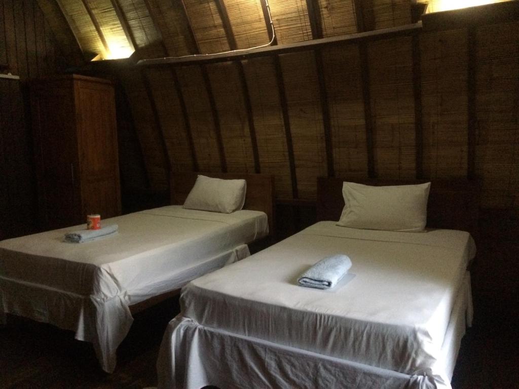 Postel nebo postele na pokoji v ubytování Melati Cottage