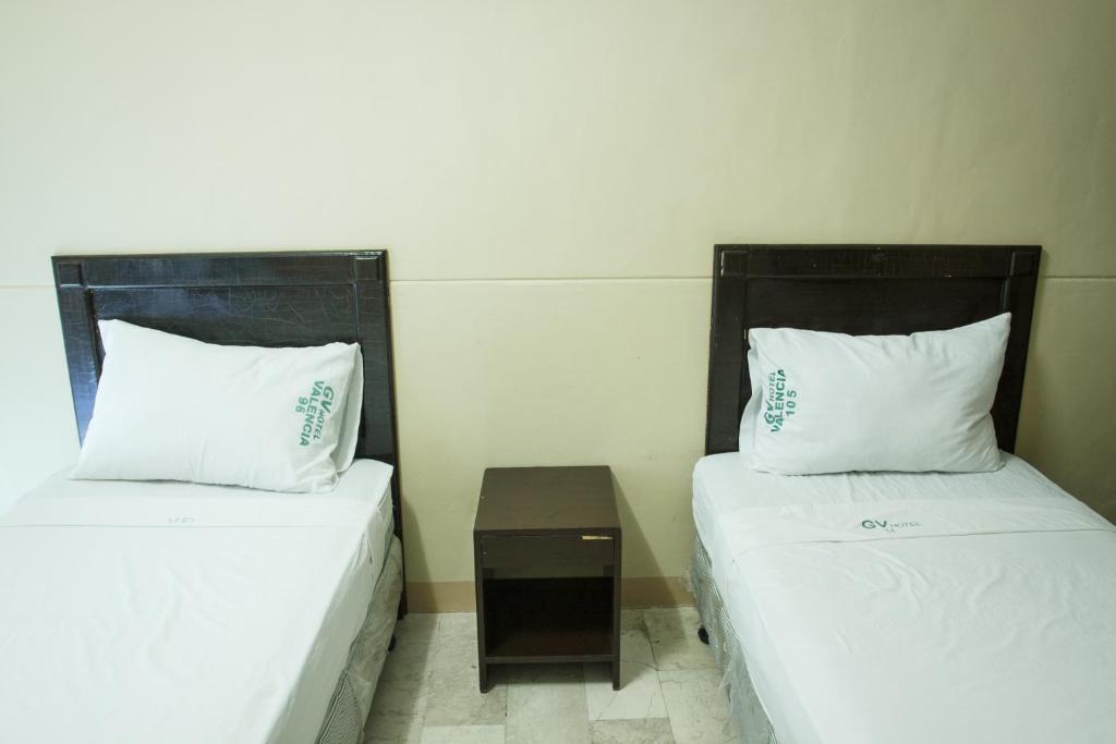 Postel nebo postele na pokoji v ubytování GV Hotel - Valencia