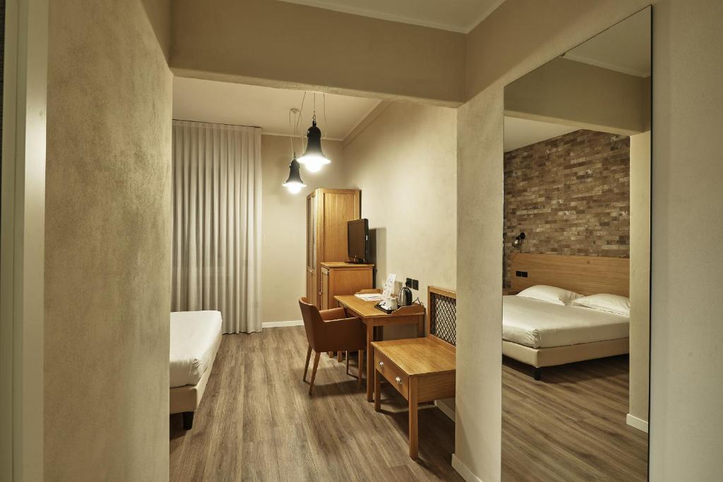 Postel nebo postele na pokoji v ubytování Hotel Miramonti