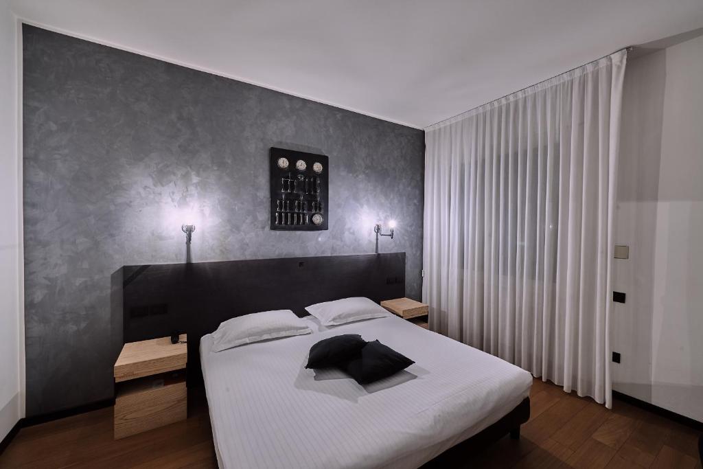 Postel nebo postele na pokoji v ubytování Hotel Miramonti