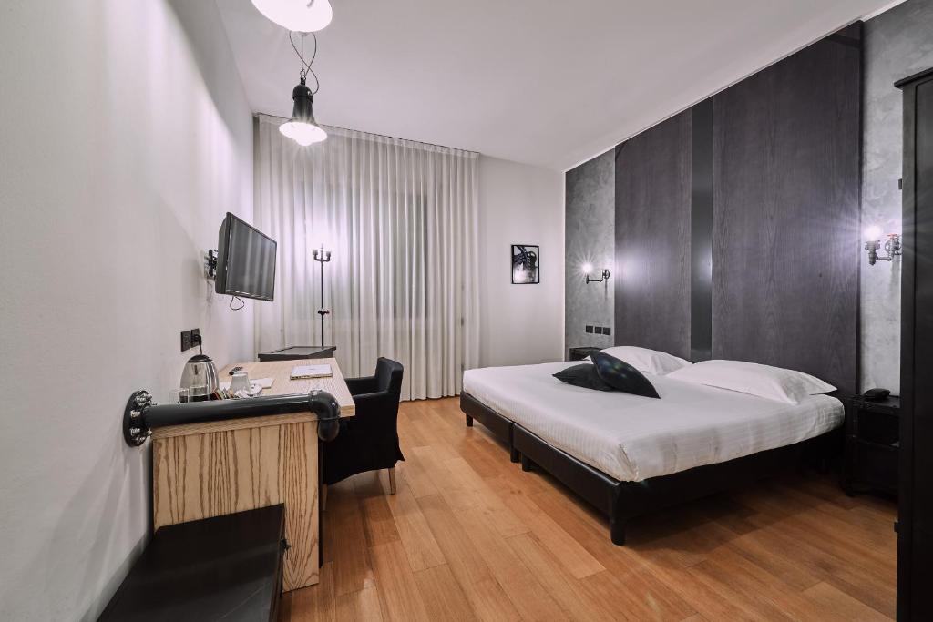Postel nebo postele na pokoji v ubytování Hotel Miramonti