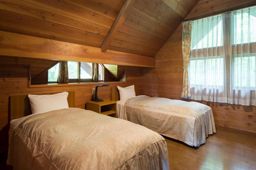 Postel nebo postele na pokoji v ubytování Izumigo AMBIENT Azumino Cottage