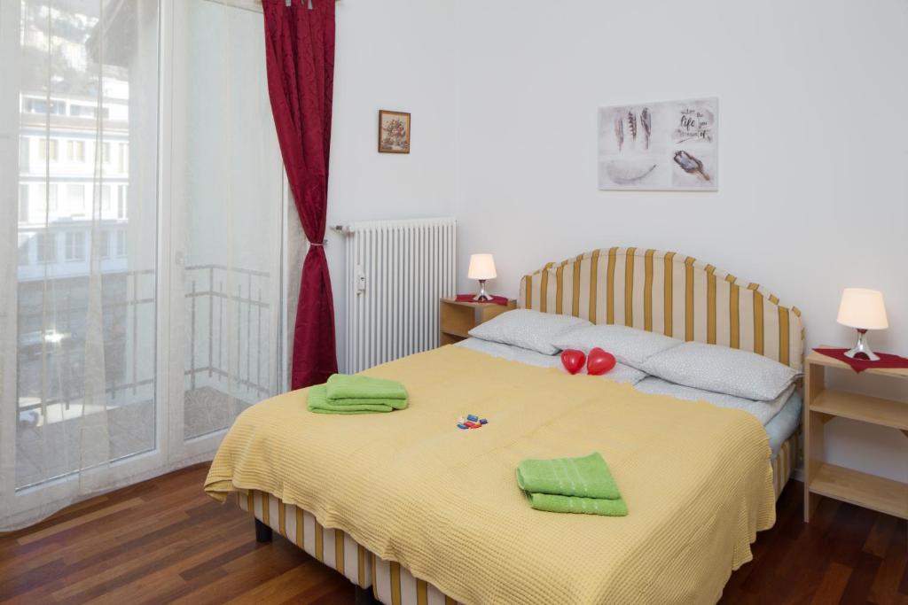 Postel nebo postele na pokoji v ubytování Rooms Al Festival