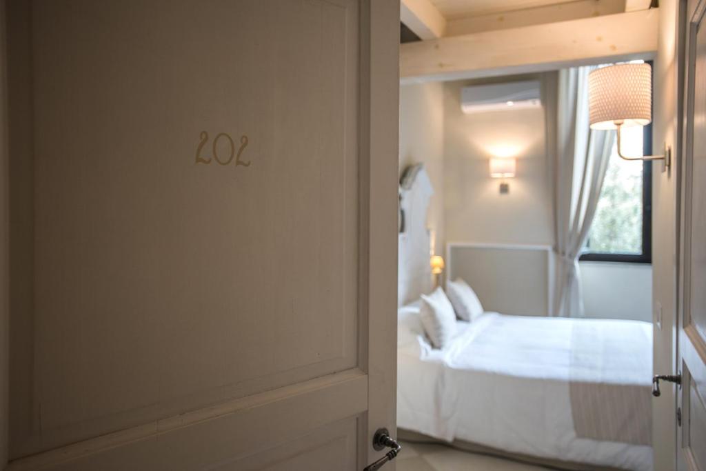 Łóżko lub łóżka w pokoju w obiekcie Palazzo Belsanti