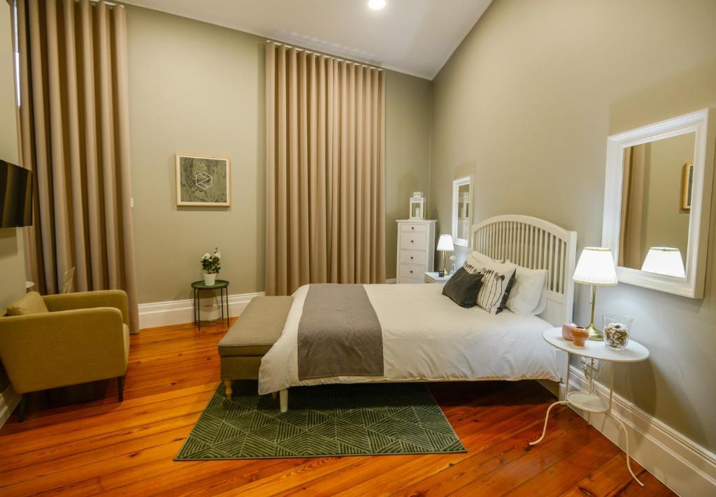 Ένα ή περισσότερα κρεβάτια σε δωμάτιο στο Casa Conforto