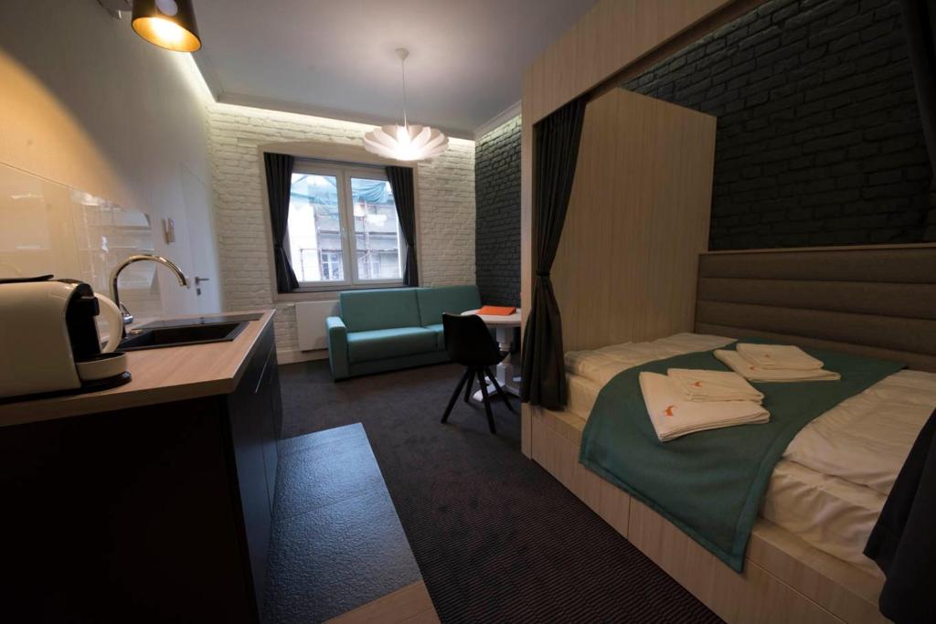 Posteľ alebo postele v izbe v ubytovaní Apartamenty Wodna 13