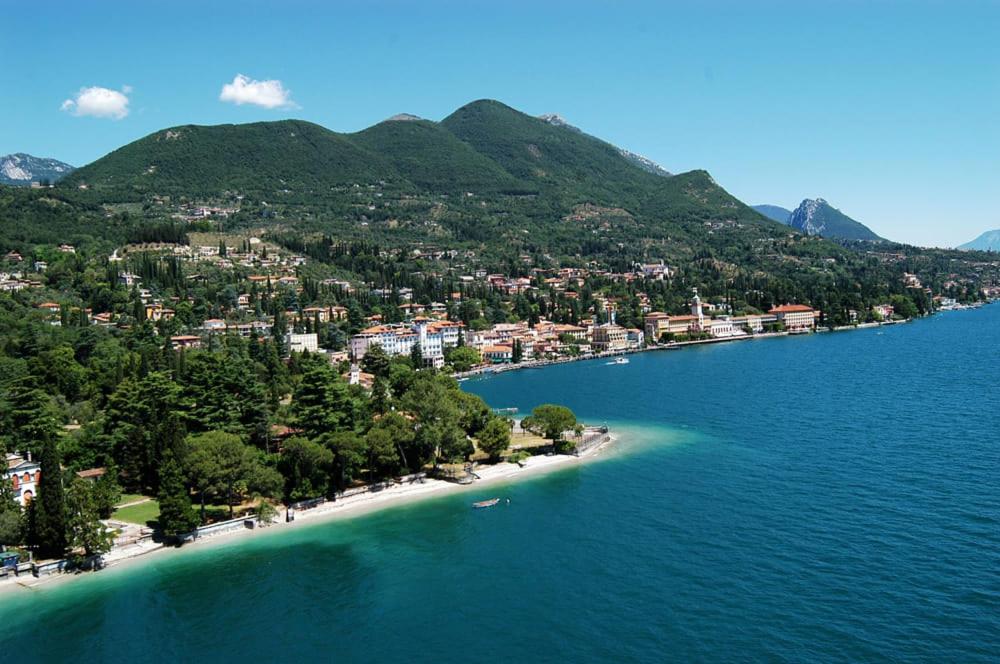 an island in the middle of a body of water at apartment Zagara - Gardone Riviera center in Gardone Riviera
