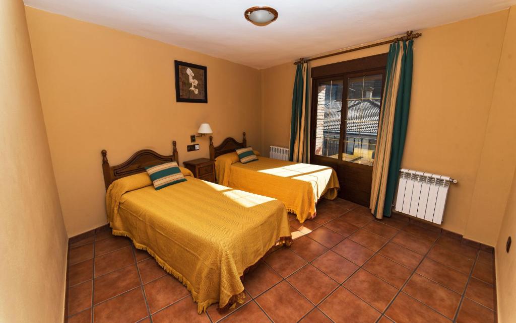 Postel nebo postele na pokoji v ubytování Apartamentos Raisa