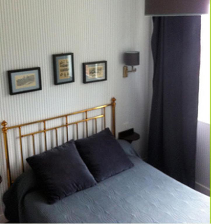 Postel nebo postele na pokoji v ubytování Logis Terrasse Hôtel