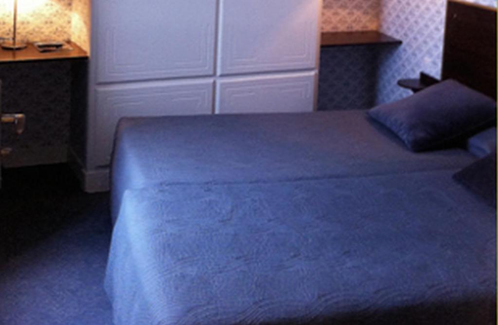 Postel nebo postele na pokoji v ubytování Logis Terrasse Hôtel