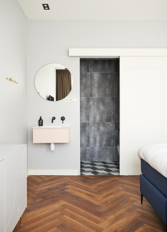 Postel nebo postele na pokoji v ubytování Hotel Pistache Den Haag