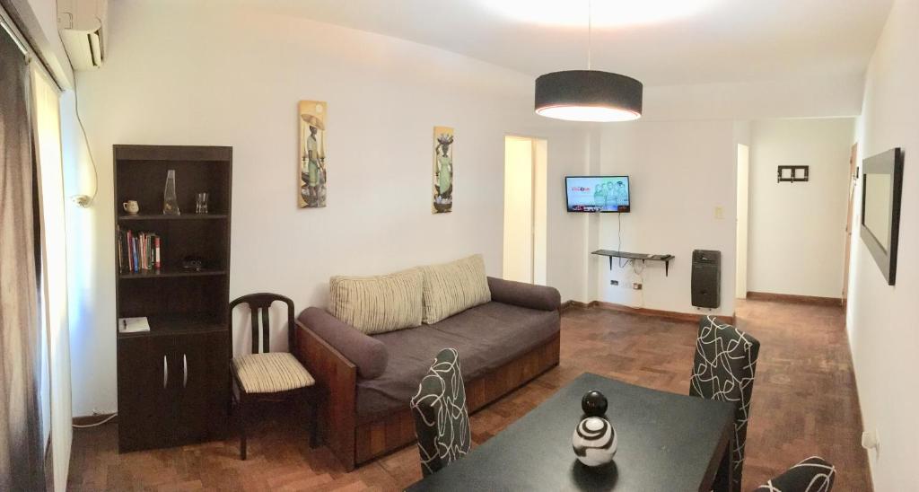 a living room with a couch and a table at San Isidro Flat in San Isidro