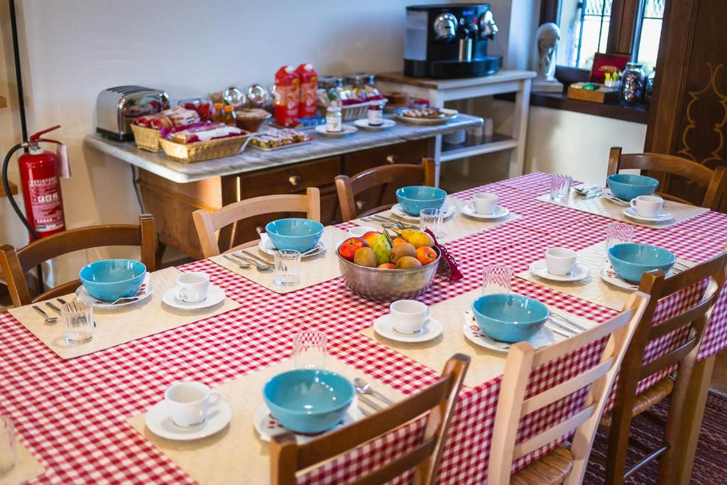 a table with a red and white checkered table cloth at Cascina Gaggioli in Milan