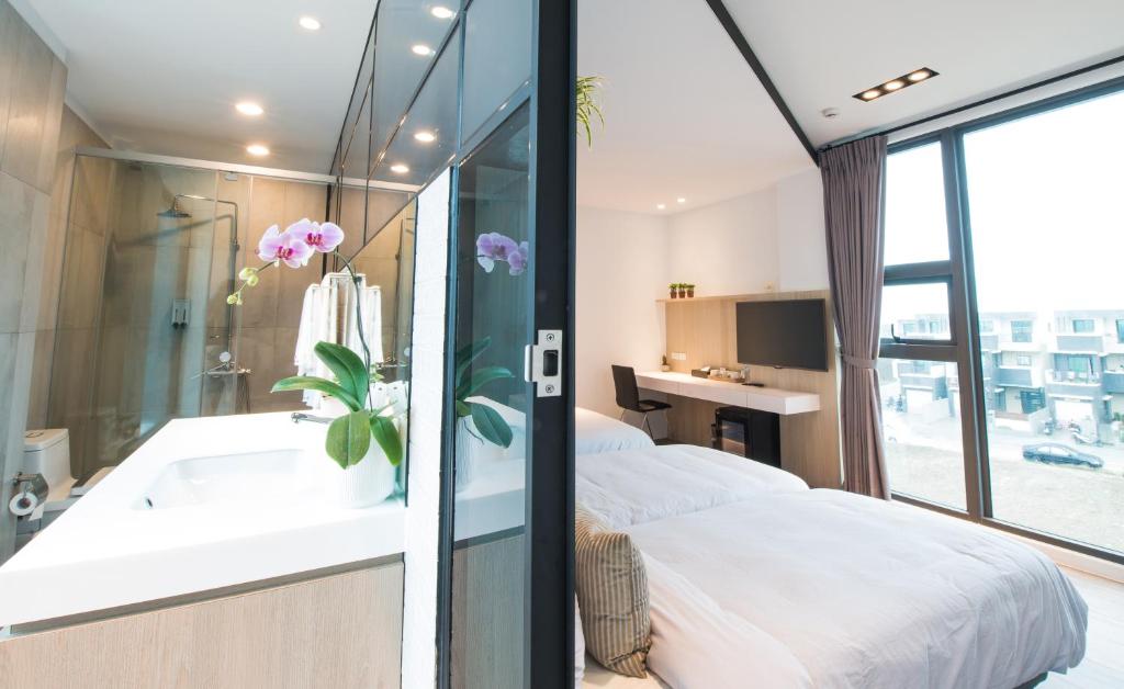 Postel nebo postele na pokoji v ubytování Galilee B&B 加利利海民宿