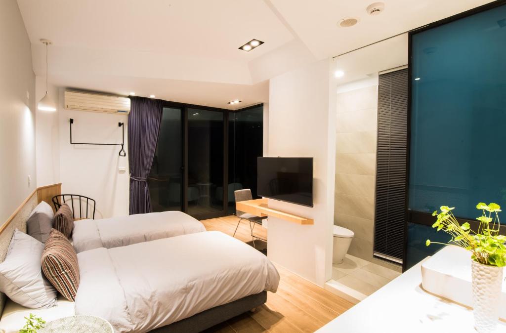 Postel nebo postele na pokoji v ubytování Galilee B&B 加利利海民宿