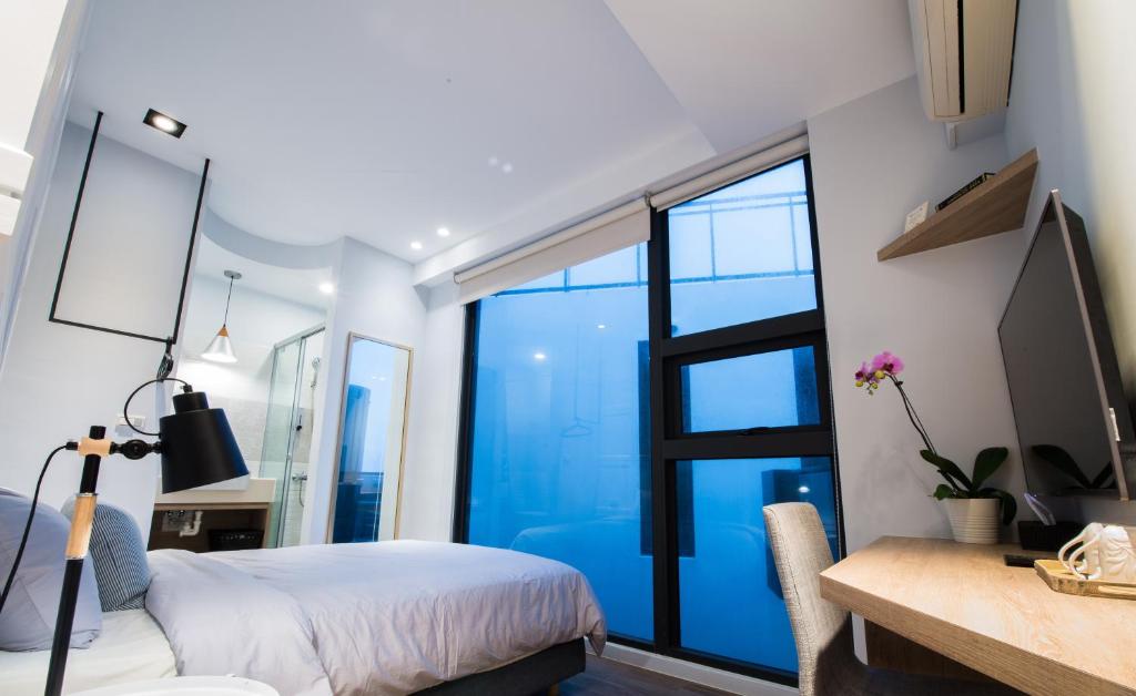 Postel nebo postele na pokoji v ubytování Galilee B&B 加利利海民宿