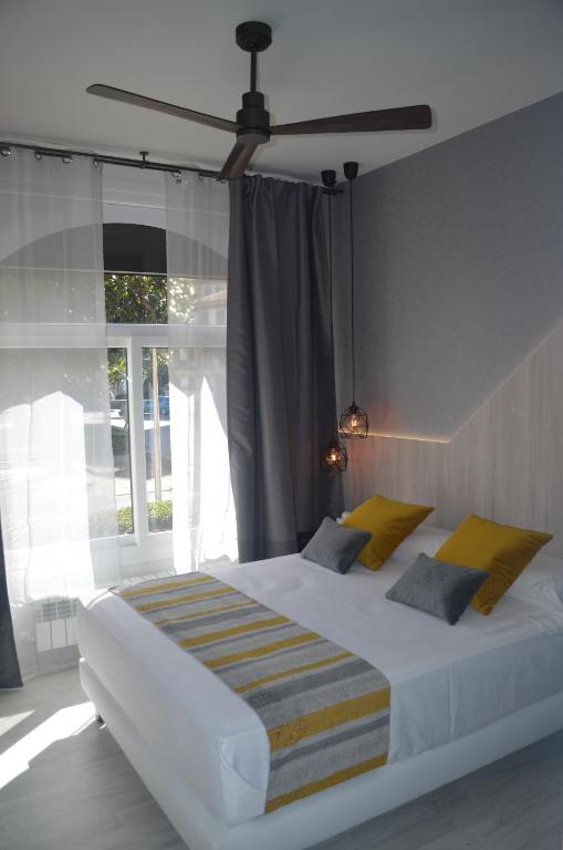Postel nebo postele na pokoji v ubytování Hotel Onyarbi