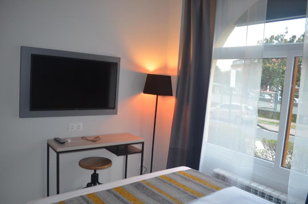 TV a/nebo společenská místnost v ubytování Hotel Onyarbi