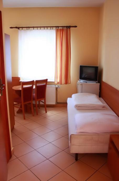 Postel nebo postele na pokoji v ubytování City Hostel