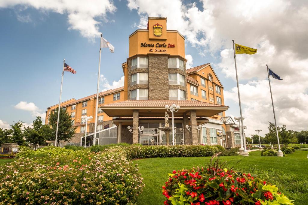 a building with a clock on top of it at Monte Carlo Inn & Suites Downtown Markham in Markham