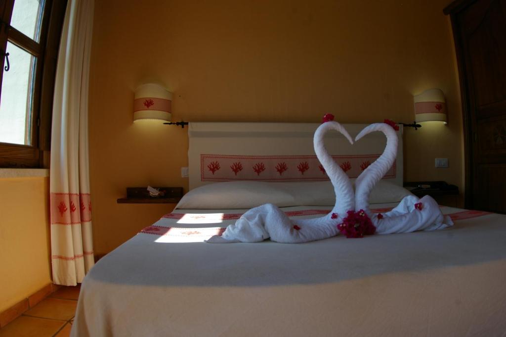 Postel nebo postele na pokoji v ubytování Santa Maria Resort