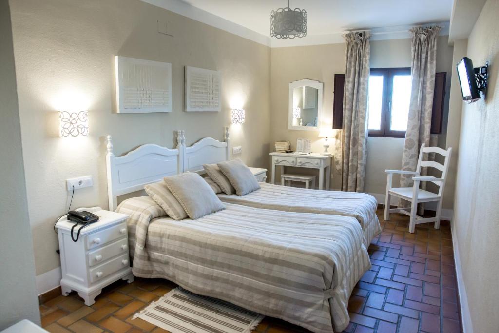 Cama o camas de una habitación en Hotel Zuhayra